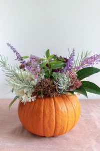 Pumpkin filled with floral arrangement 